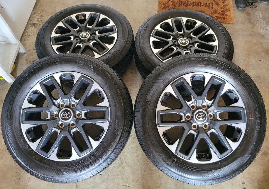 20 inch rims Stock rims and tires TOYOTA TUNDRA all matching YOKOHAMA GEOLANDAR X-CV 265/60/20 BRAND NEW RIMS AND TIRES from a 23 Tundra rines