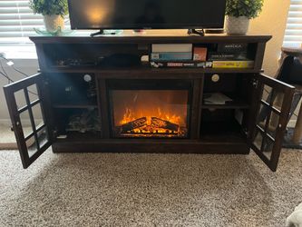 Fire place entertainment center (has heat and remote)