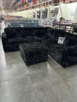 4-Piece Sectional Set W/ Ottoman
Reversible Loveseat + Reversible Loveseat W/USB Console & Cup Holders + Corner Wedge + Cocktail Ottoman

Color: Black