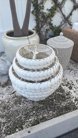coastal-style layered shell or coconut disc design like the Serena & Lily