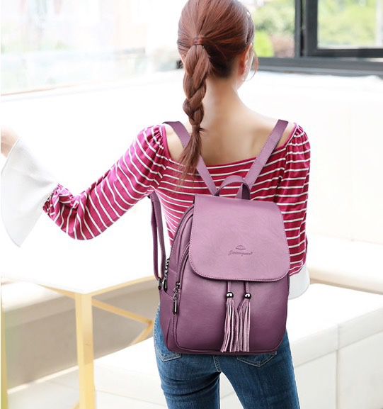 Super cute women’s backpack with tassels and side phone pocket