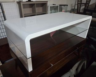 Assorted glossy white coffee tables