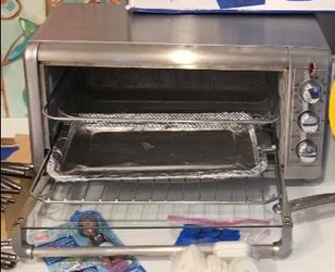 BLACK + DECKER 
With an Air fry fan inside, very clean working well. Inside tray always had aluminum foil so it is grease-free, has a tray down it pic