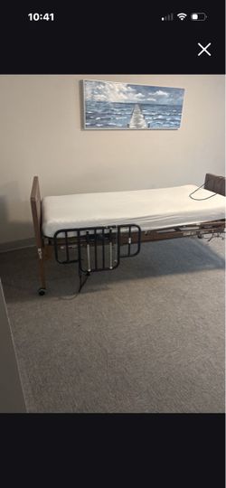 Electric hospital bed with side rails
