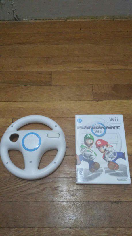 Wii Mario Kart With Steering Wheel Only Used A Couple Of Times. Message me anytime if interested will send more pictures or videos thank you.