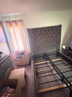 Grey tufted bed