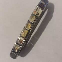 18 link silver with gold details Italian charm bracelet
-about 9mm thick and 7 inches long