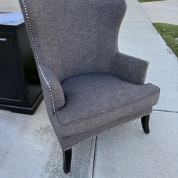Designer studded gray upholstery club chair