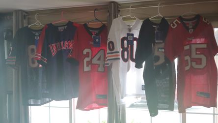 4 NFL jerseys. 1 Baseball. New with tags.