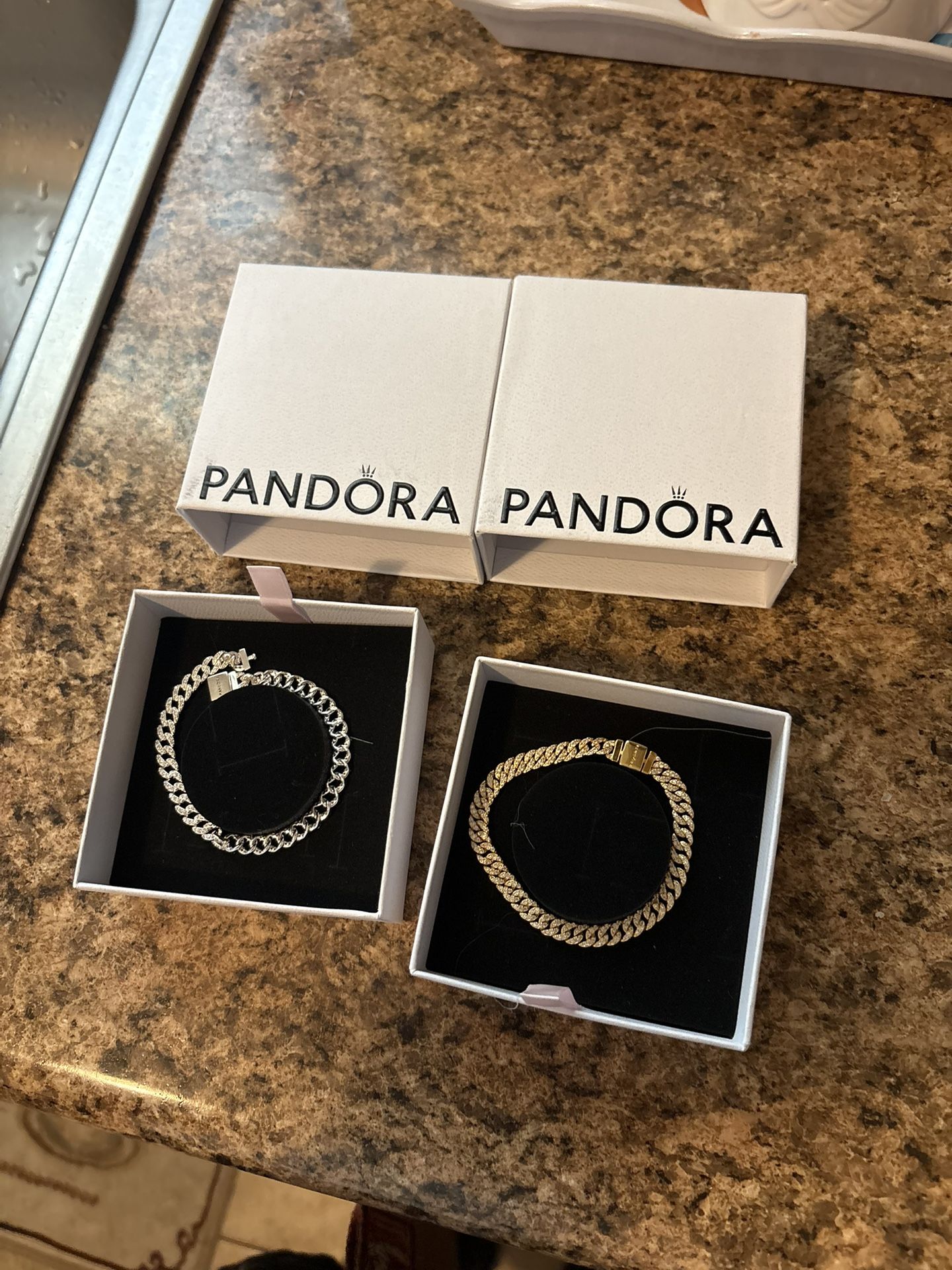 Gold and silver Pandora bracelets