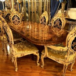 Dining Room Table And Chairs And A Gold And Browns Hutch