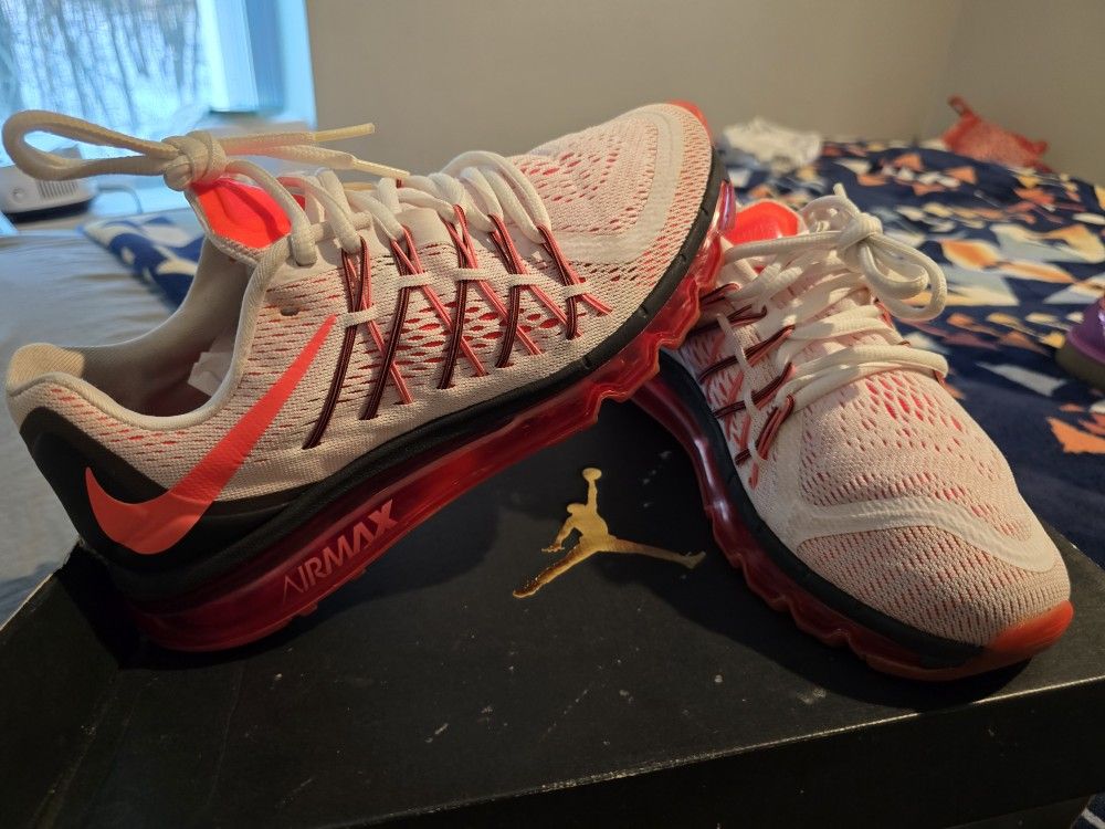 Nike Air Max sneakers in white and red. Stylish and comfortable design.