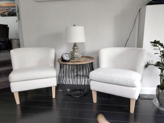 2 each ivory colored fabric chairs with round nautical /coastal table w/glass