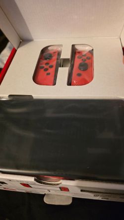 Nintendo Switch with Red Joy-Con Controllers