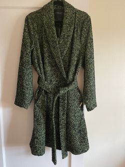 Brand new never worn with tags. Size Large Green and black tweed coat with 2 snap buttons, removable belt and pockets. Smoke free dog friendly home.