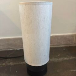 Off white-tan fabric shade lamp with black base