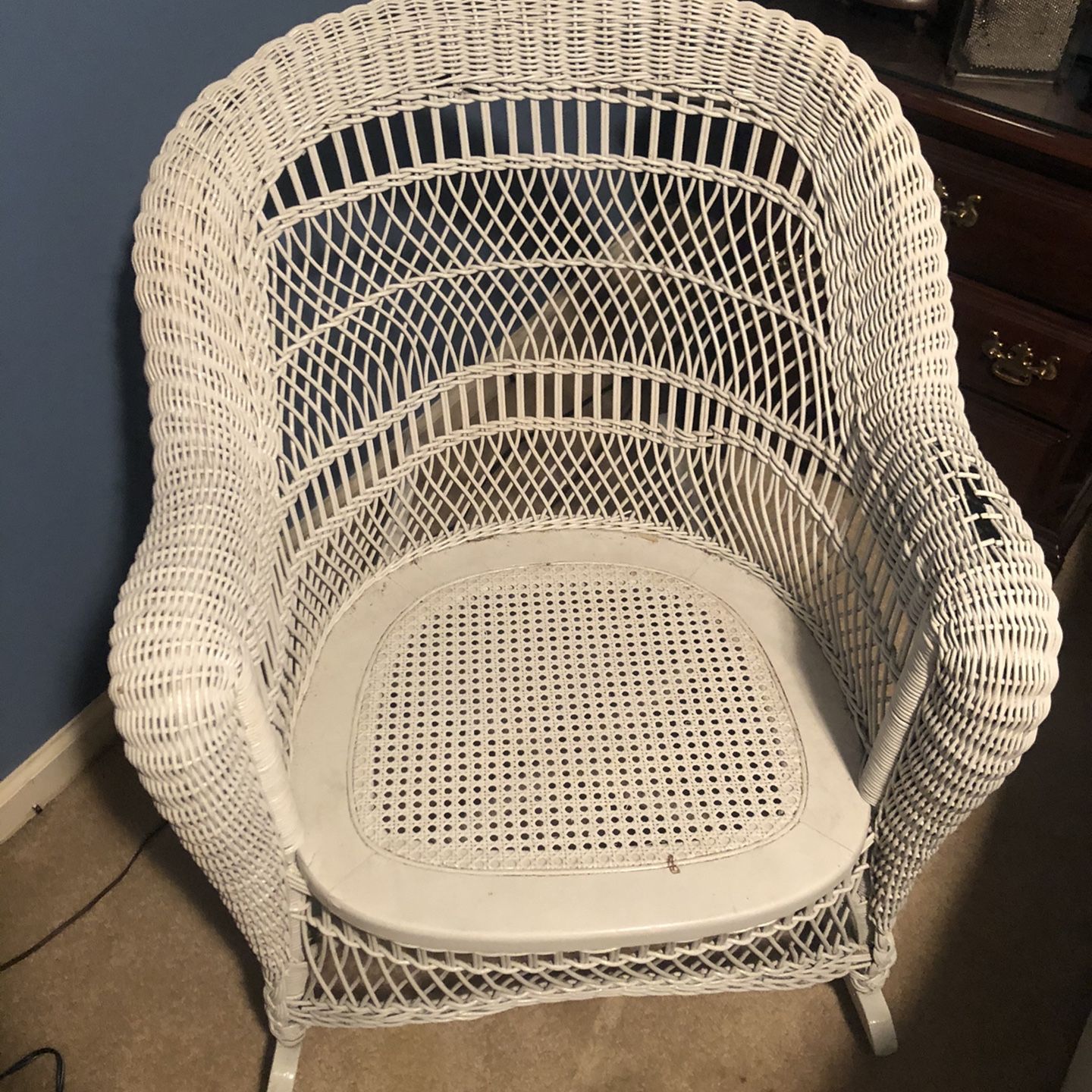 White Wicker Rocking Chair with Intricate Design