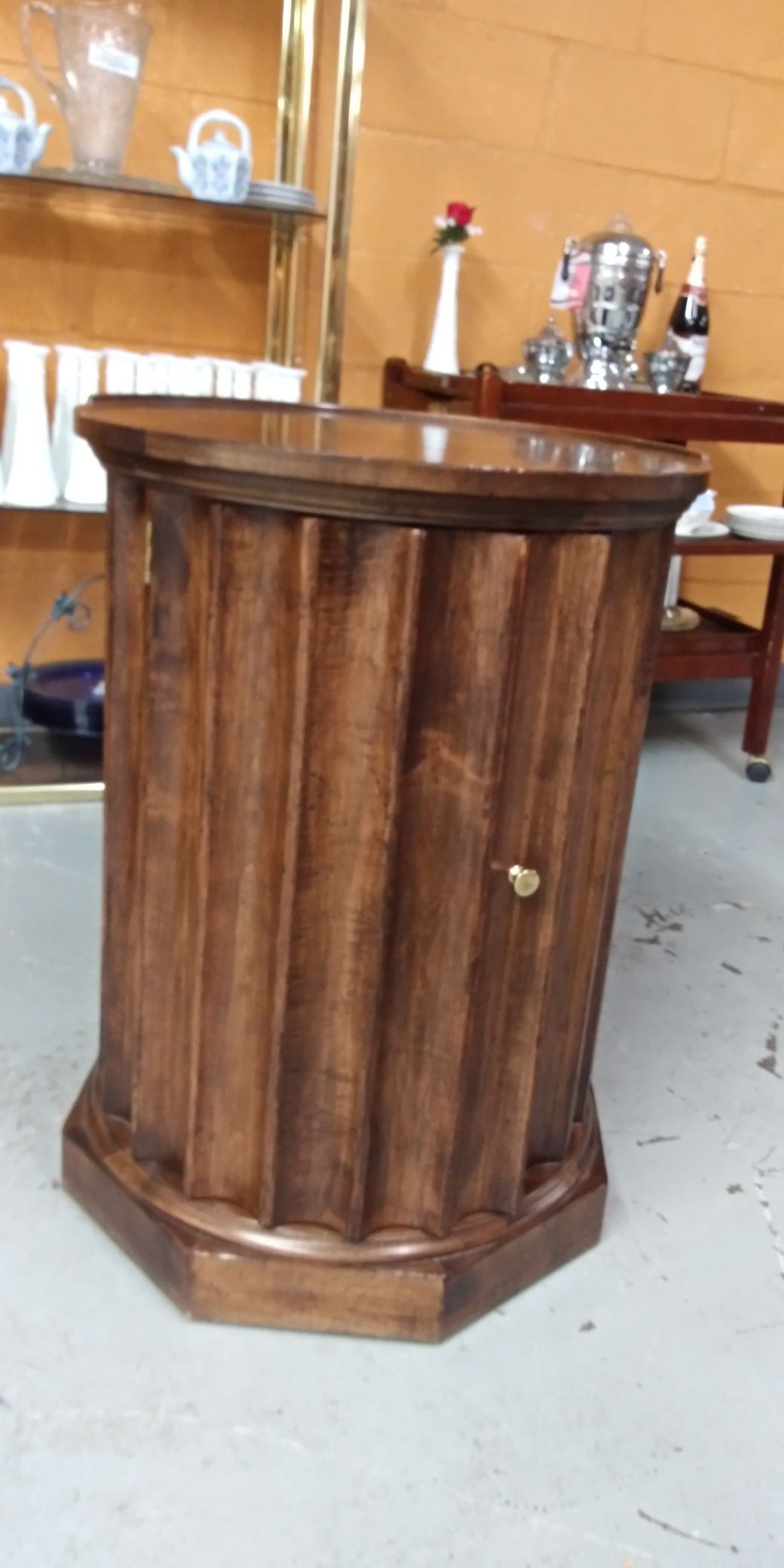 Baker Furniture! Brown drum table with open door storage for sale