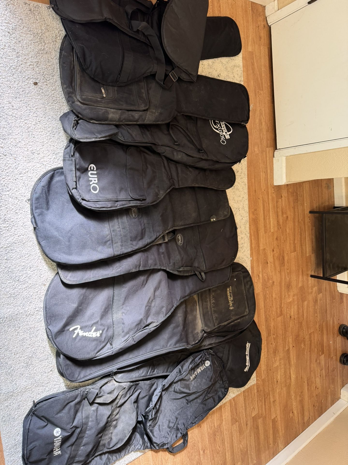 Guitar cases group of 12