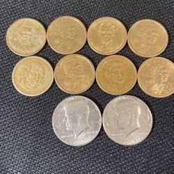 One Dollar Coins And Two Half Dollars 