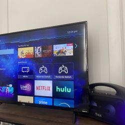 TCL 43inch 4K TV, Tribit Stormblast Speaker and a Table 