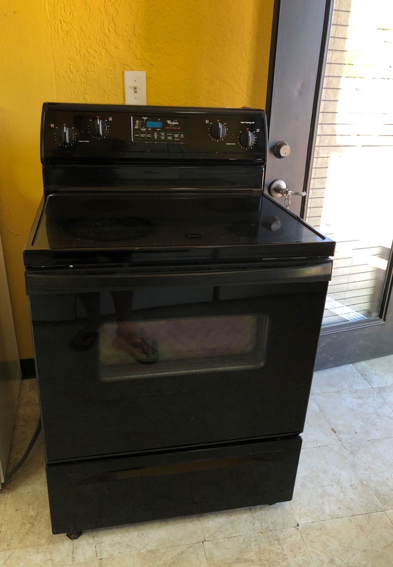 Black whirlpool glass top stove. Clean, and works great for Sale in