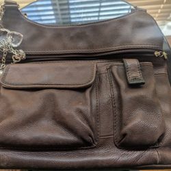 Fossil PurseUsed fossil purse. Good condition. No holes on exterior or interior. Light scruff marks on the outside. 