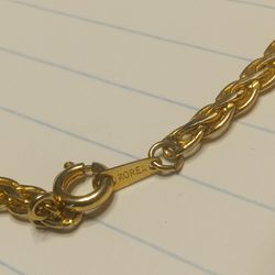 "Gold" chain with "KOREA" stamped on it.