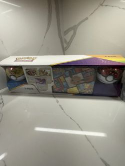 Pokemon Eevee Evolutions 3-Pack Treasure Chest Tin & 2 PokeBalls - Costco 