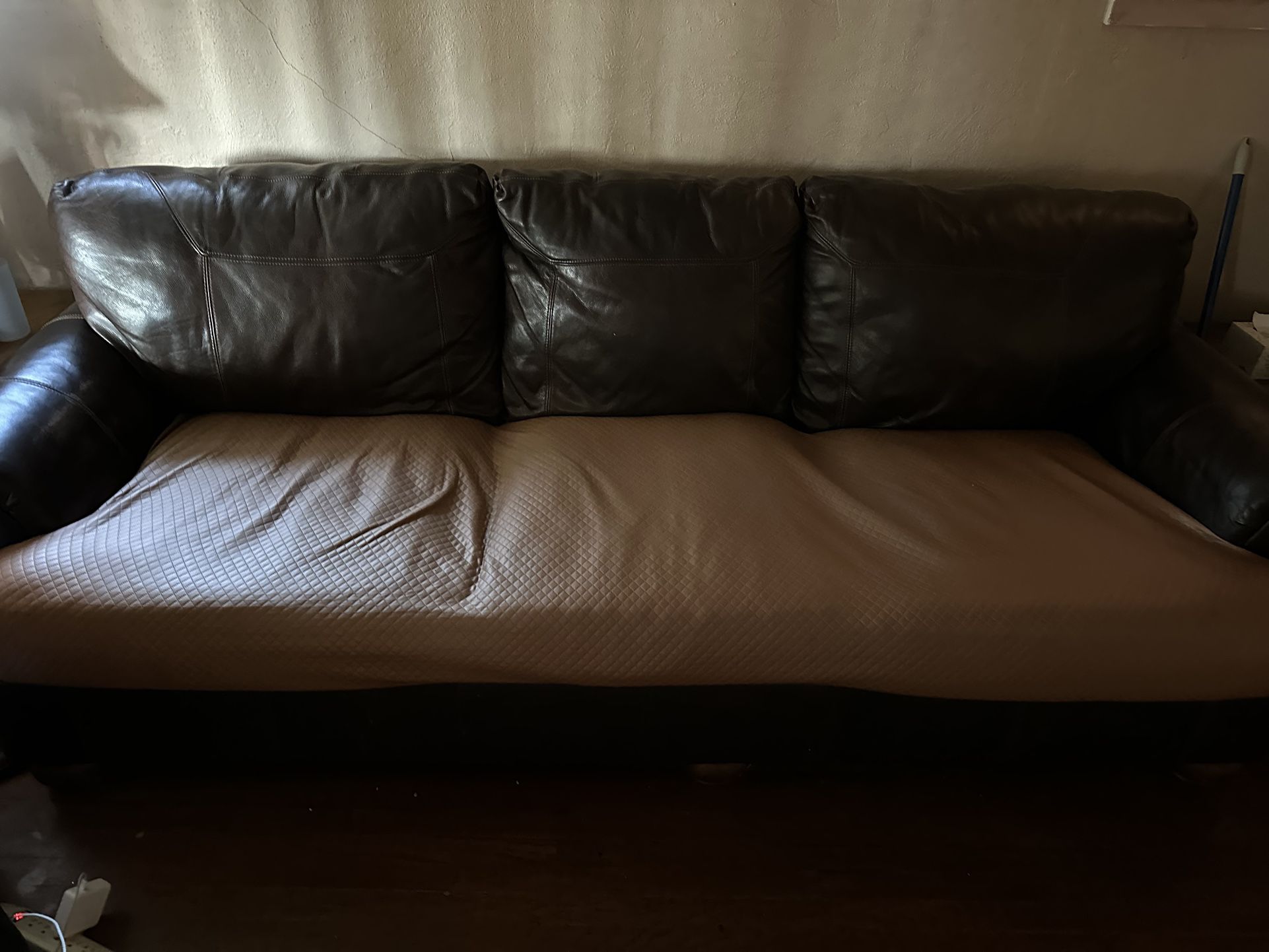 Leather Couches  (there’s 2)