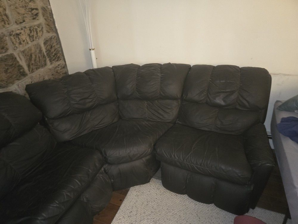 4-Piece Black Leather Sectional with Fold-Out Bed & Recliners