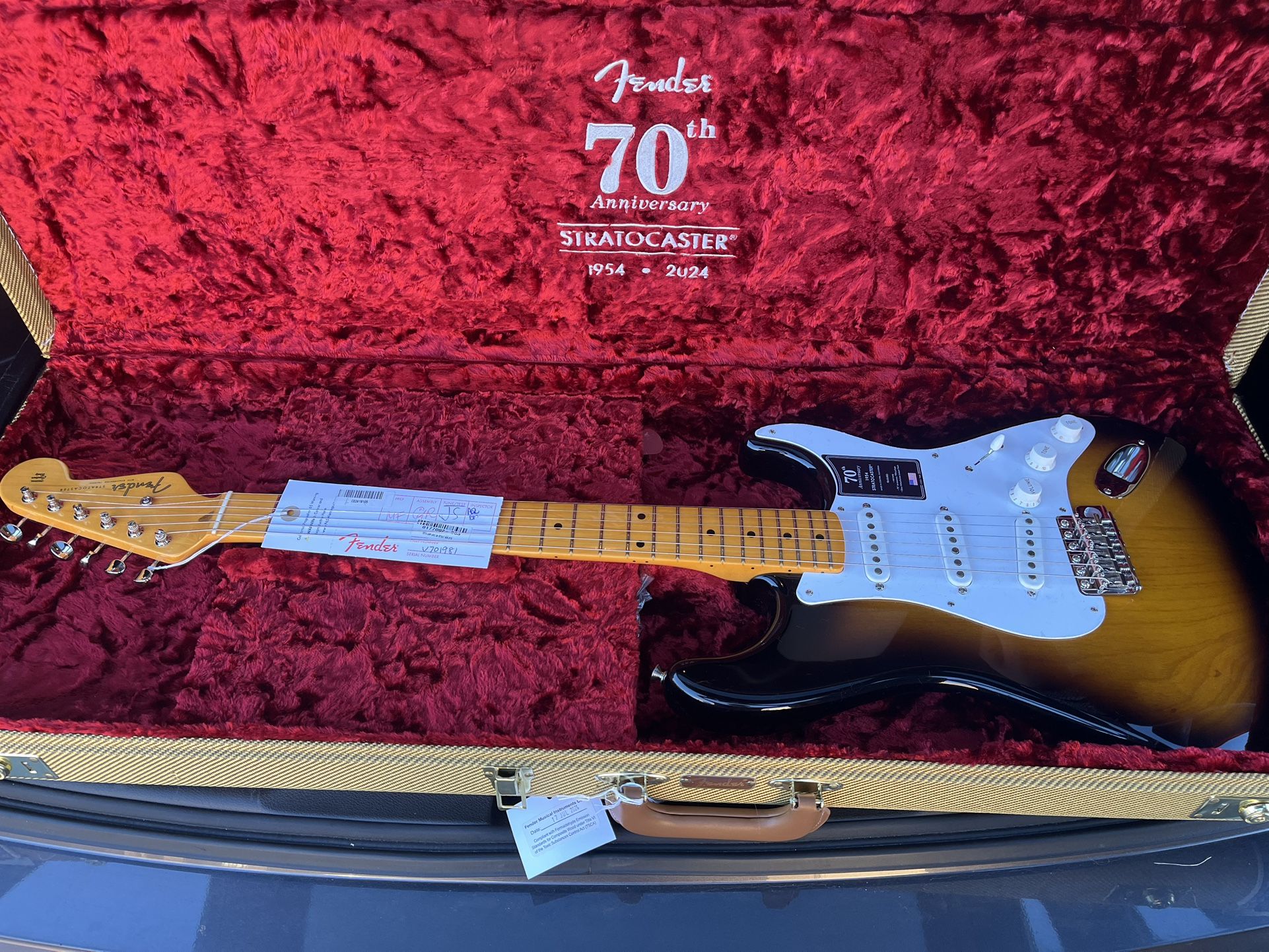 Two Fender Guitars With Cases