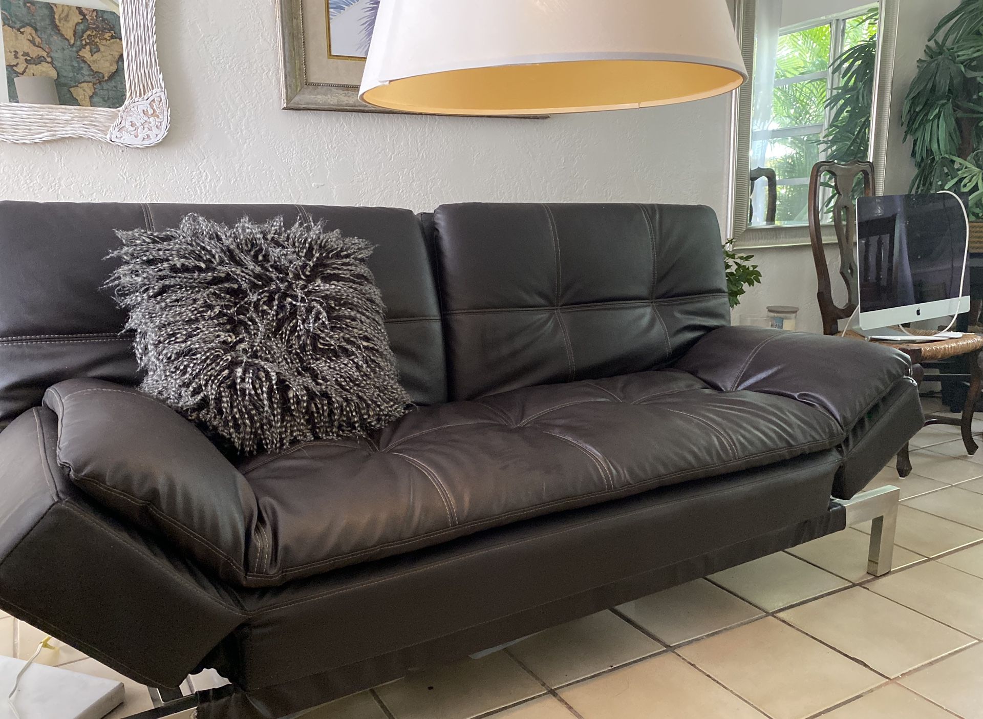 Sofa futon black leather , like new