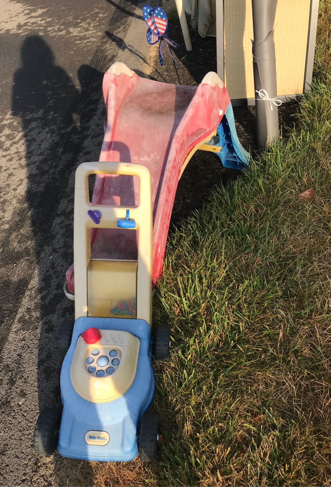 Free toddler slide & toy lawn mower at curb
