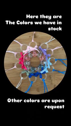 Baby shower/gender reveal pacifier necklace game