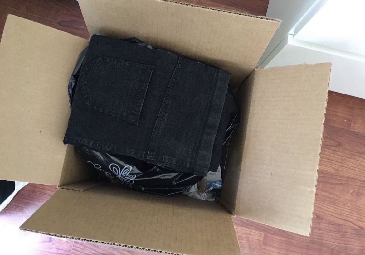 Box of Maternity Clothes and Supplies