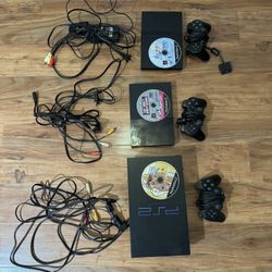 Lot Of Ps2 Consoles With Cables, Controllers, And Games