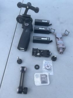DJI Osmo+ Camera Gimbal Kit w/ 3 Batteries, Rode Video-micro & X5 Lens Adapter. Please note only 2 batteries had enough charge to turn on the gimbal. 