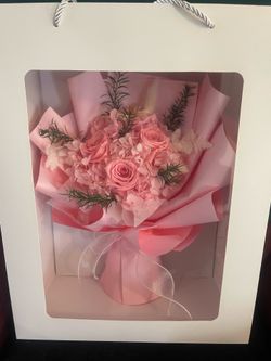 Pink faux flower bouquet gift.