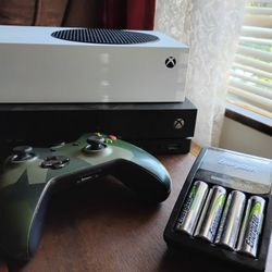 Xbox One X And Controller And Rechargeable Batteries And Battery Charger