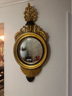 gold and black round mirror  53" tall and 35" wide, mirror