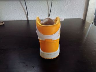 Woman's Nike Air Jordan 1 University gold