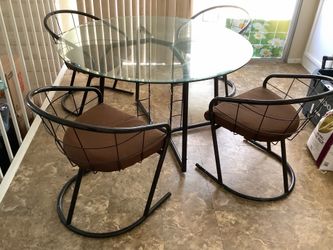 Glass table with 3 chairs.