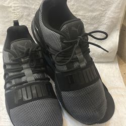 Breathable knit upper. Elastic band with prominent PUMA branding. Lace detail for adjustable fit. Cushioned sole for comfort. Sleek athletic silhouett