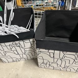 Patterned storage bins with white hangers included.