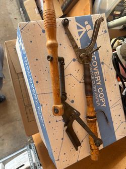 Two vintage clay disc throwers
