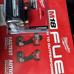 Milwaukee drill combo and an extra 6.0 battery