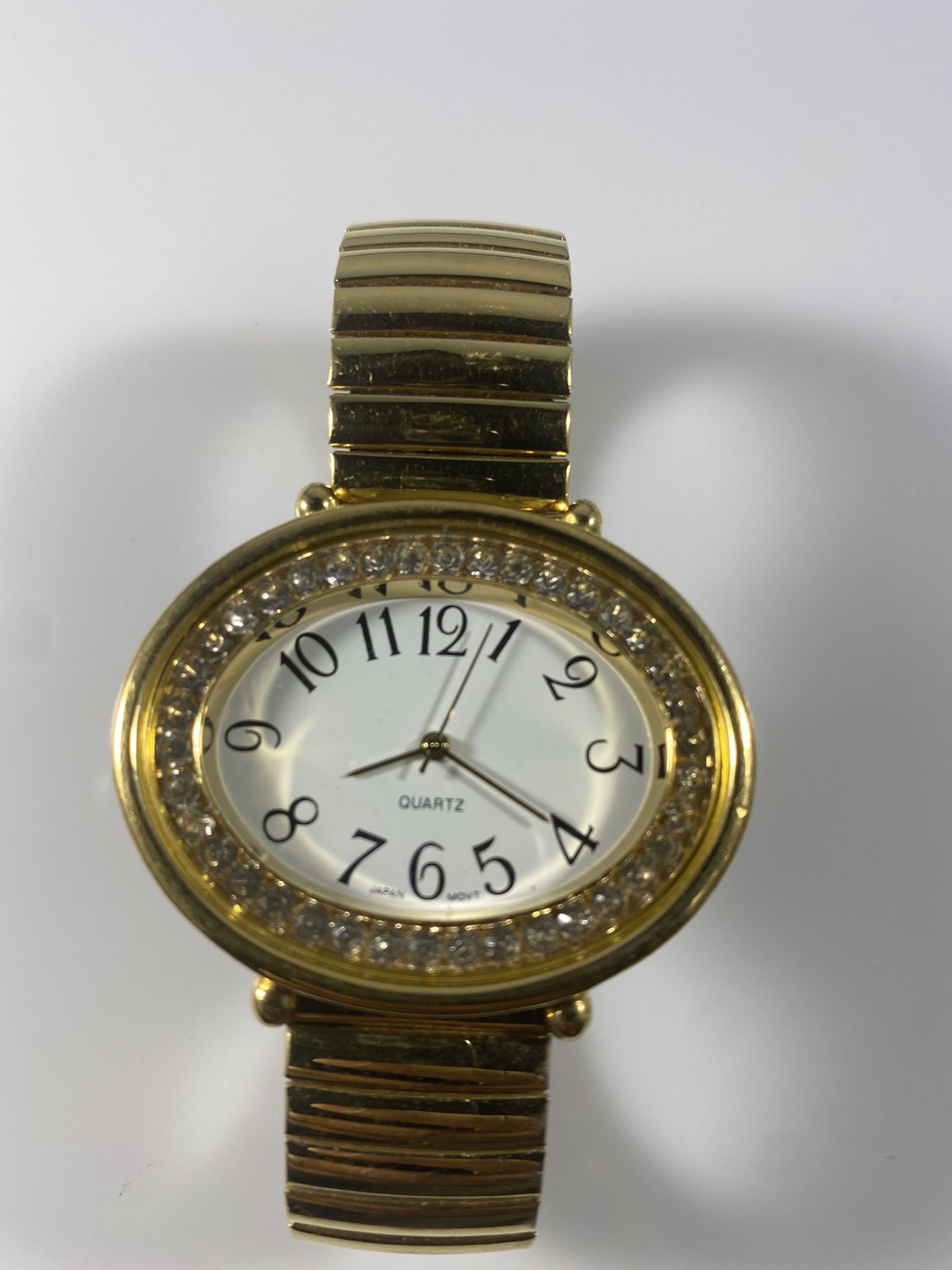 Avon Womens Gold Tone Watch with Crystal Bezel