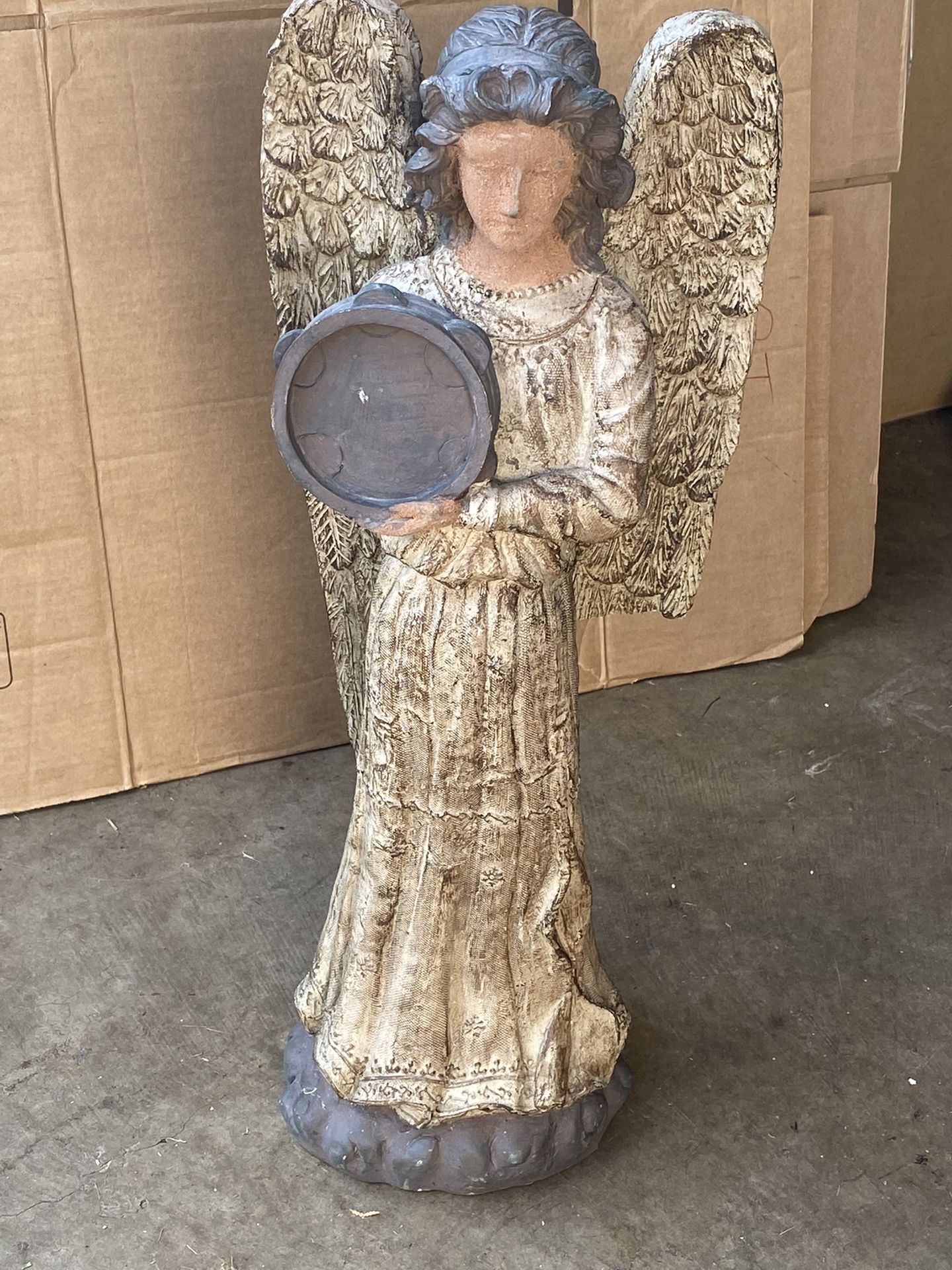 Angel Statue Has A Broken Wing .