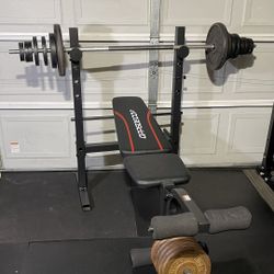 WORKOUT BENCH WITH BAR AND WEIGHTS 